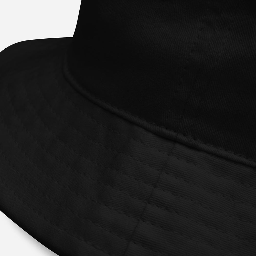 Close-up of black fishing bucket hat fabric and stitching detail from 'Tight Lines' collection