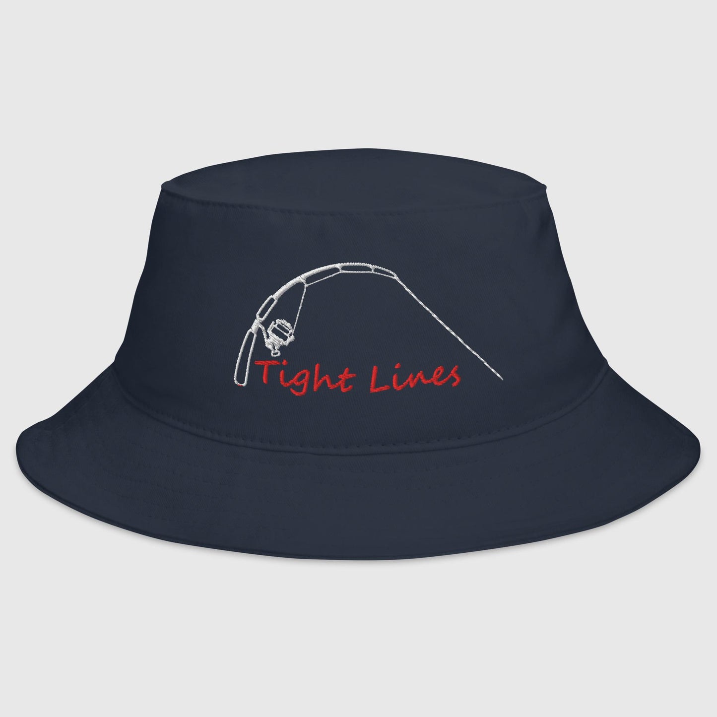 Navy fishing bucket hat with embroidered 'Tight Lines' rod and reel design in red and white thread, front view