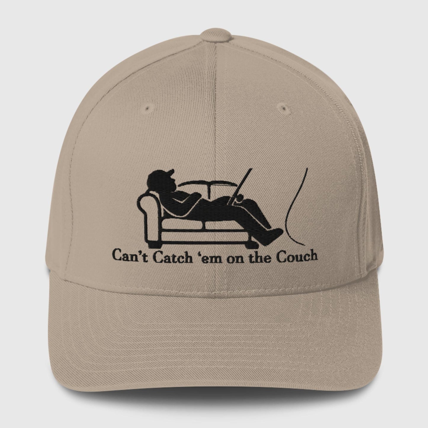 Khaki dad hat featuring black fisherman on couch with fishing rod