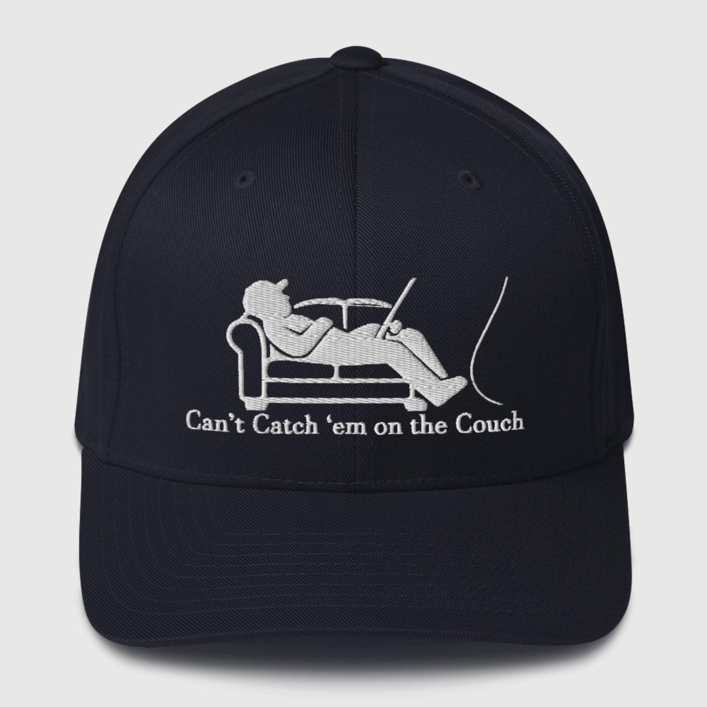 Navy dad hat with white couch and fisherman graphic, slogan underneath