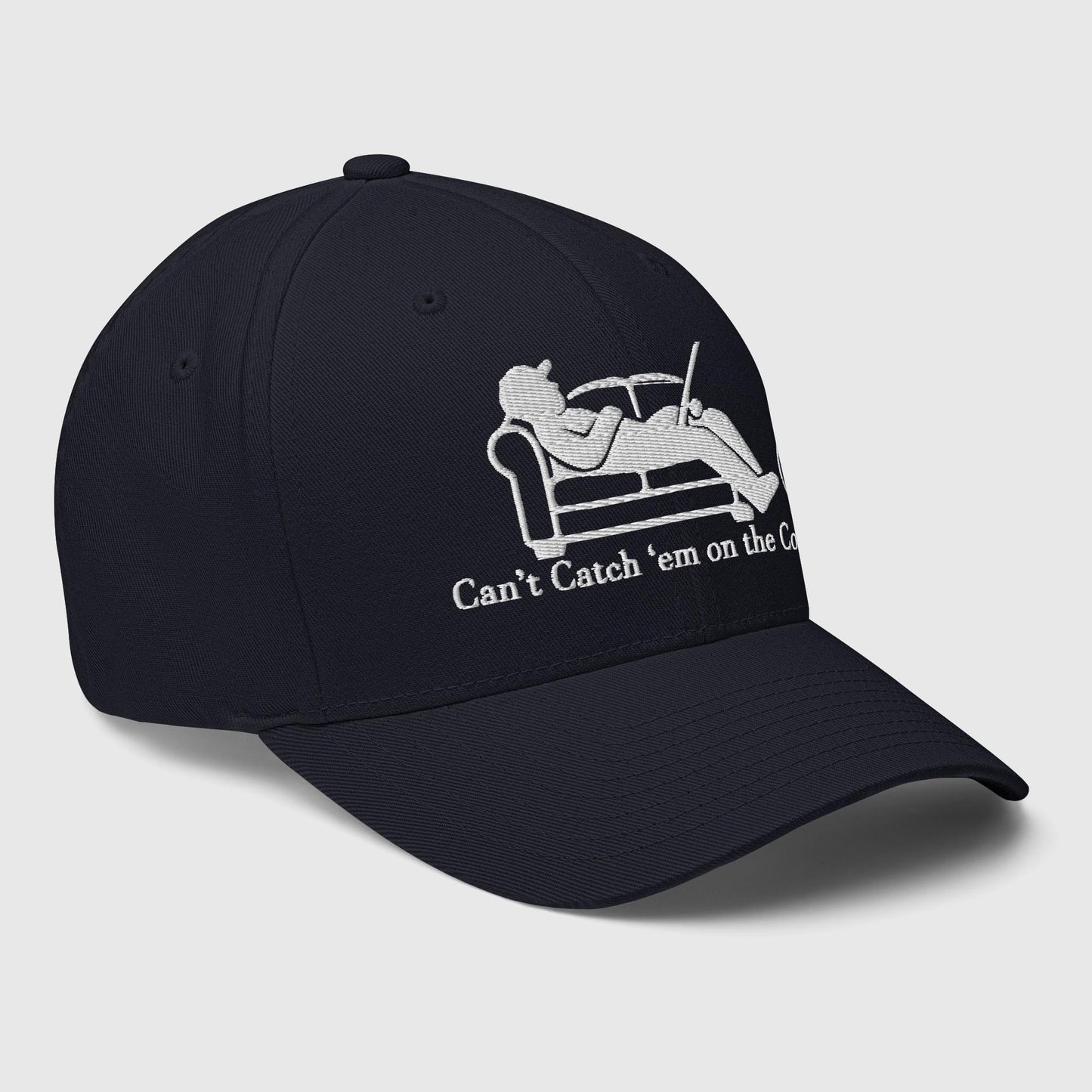Side angle view of navy structured dad hat with couch fishing logo