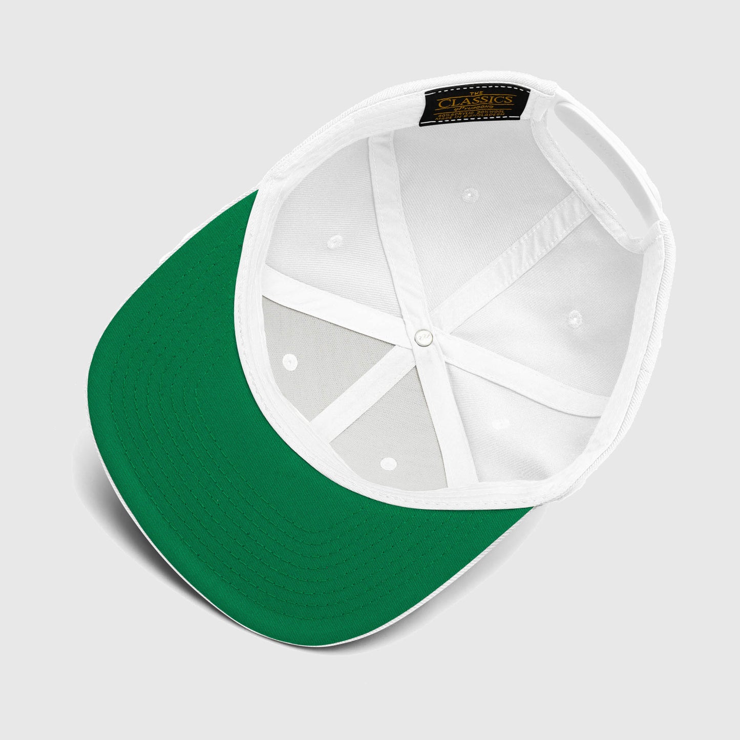 Inside detail of white snapback cap with green brim