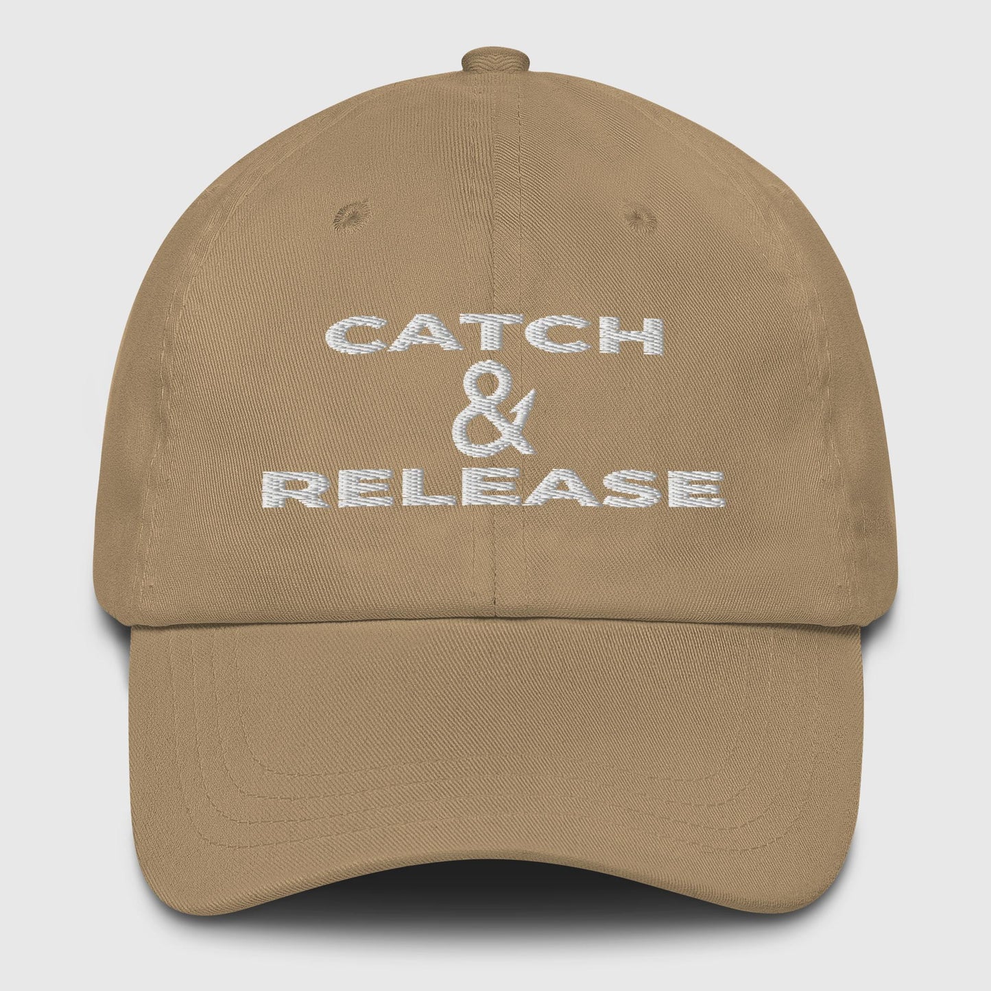 Stone khaki dad hat with black Catch & Release text