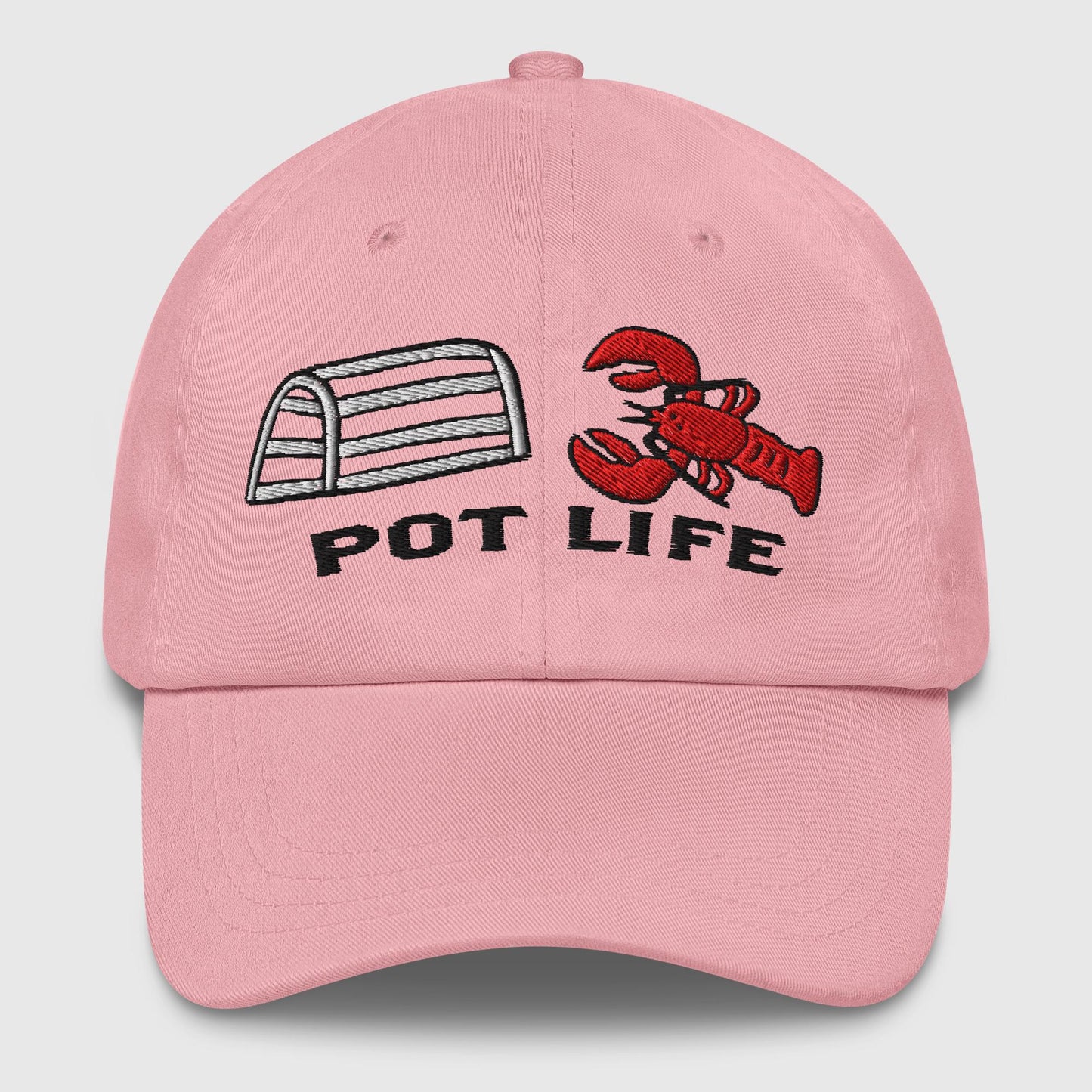 pink dad hat with embroidered lobster trap, red lobster, and "POT LIFE" text on the front