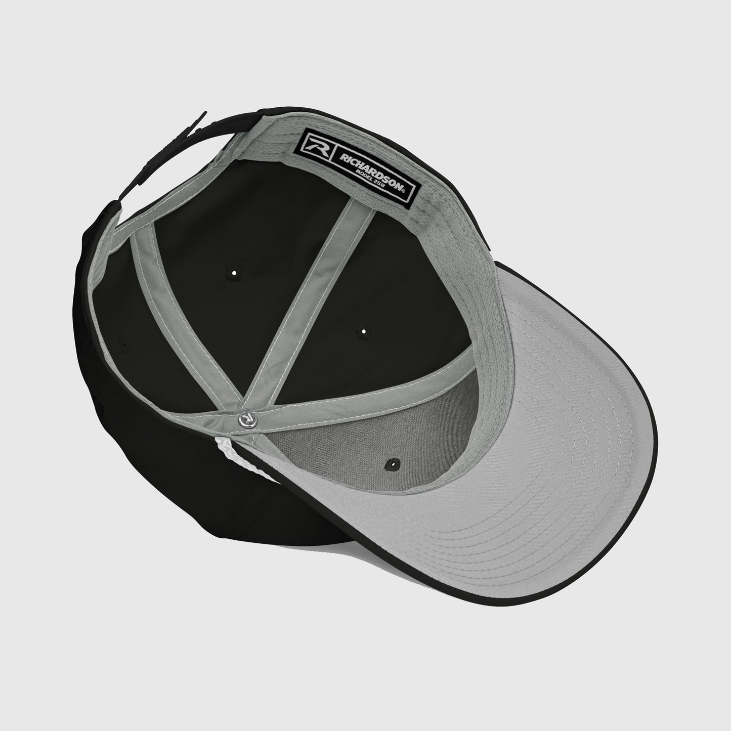 Inside view of black rope cap showing visor and stitching