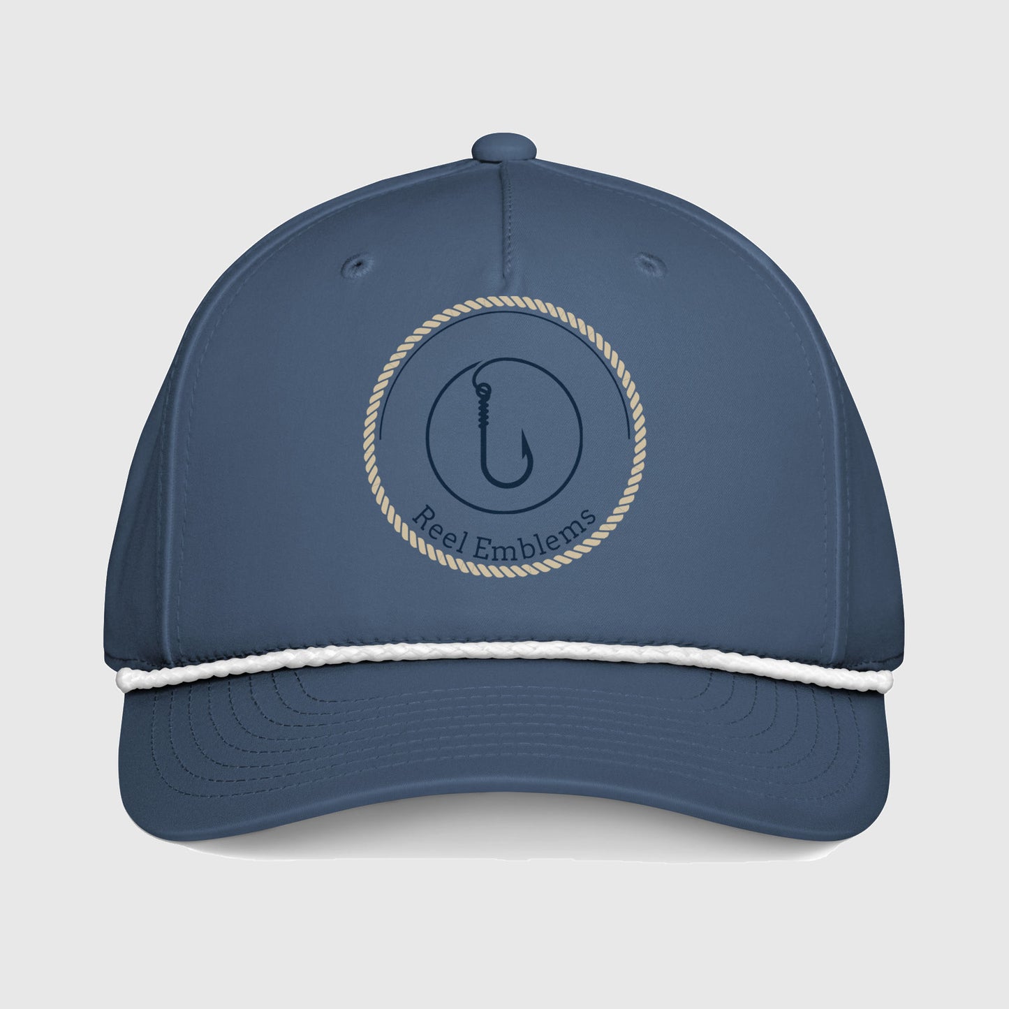 Light blue cap with “Reel Emblems” logo and white rope on a light gray background
