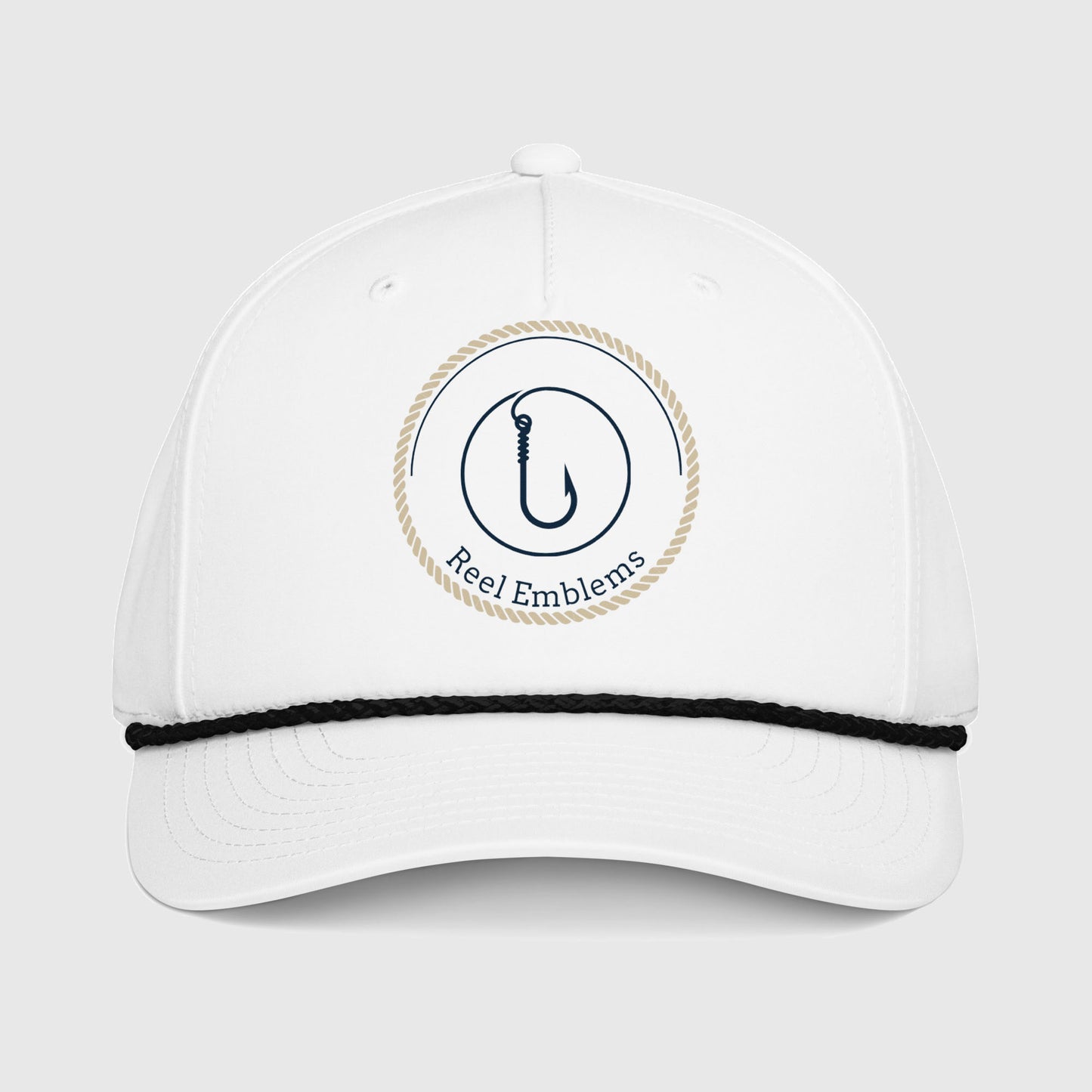 White cap with “Reel Emblems” logo on a light gray background