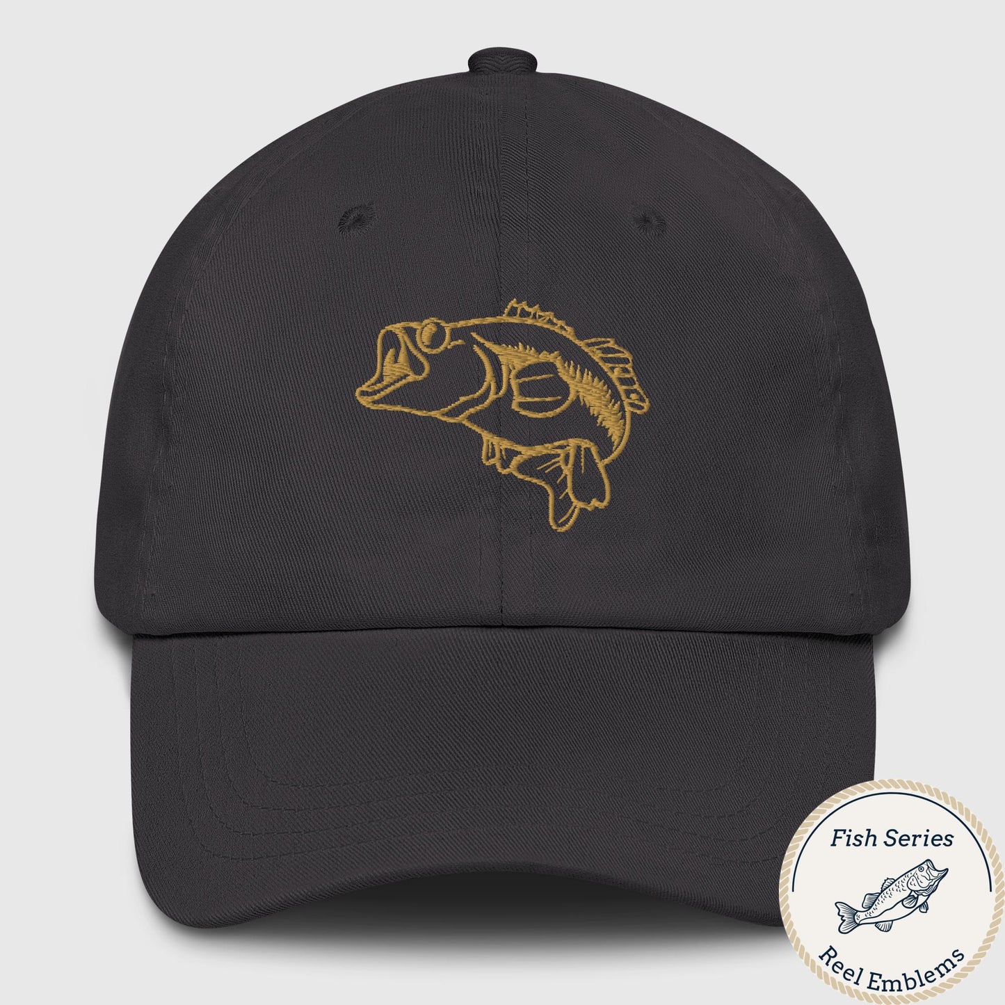 Dark grey dad hat with embroidered largemouth bass design in gold thread, front view