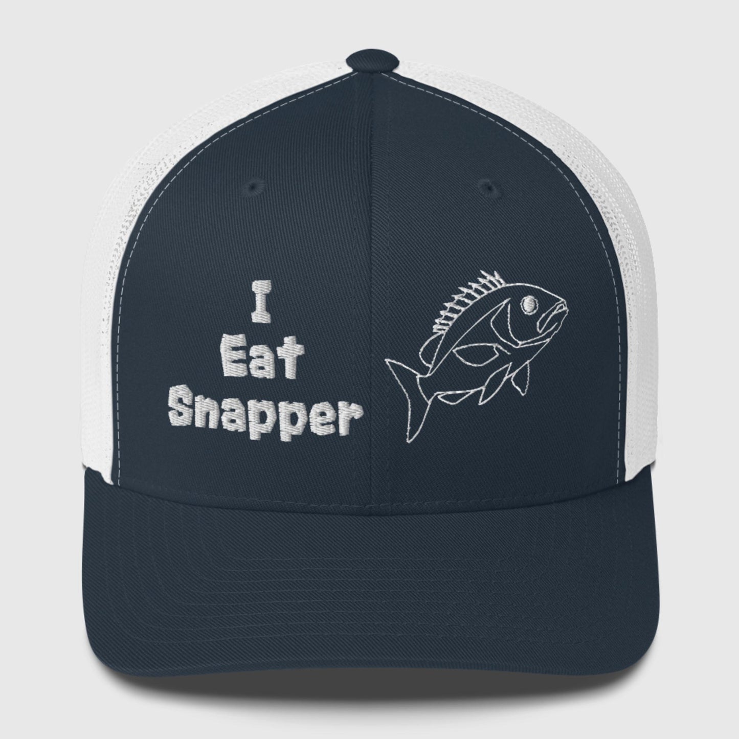 White mesh back navy front panel trucker cap with white “I Eat Snapper” text and fish embroidery, front view