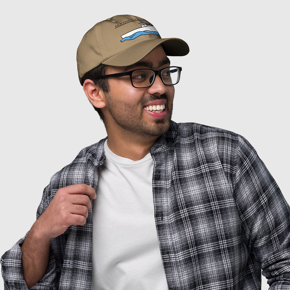 Reel Emblems embroidered dad hat with Maine lobster boat design on khaki cap, shown on model in plaid shirt