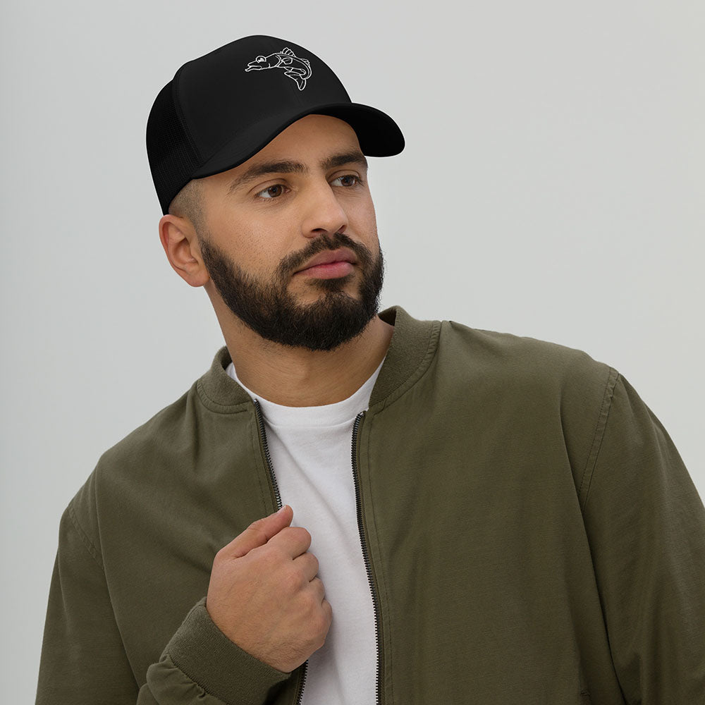 Man wearing black retro trucker cap with white embroidered snook fish design