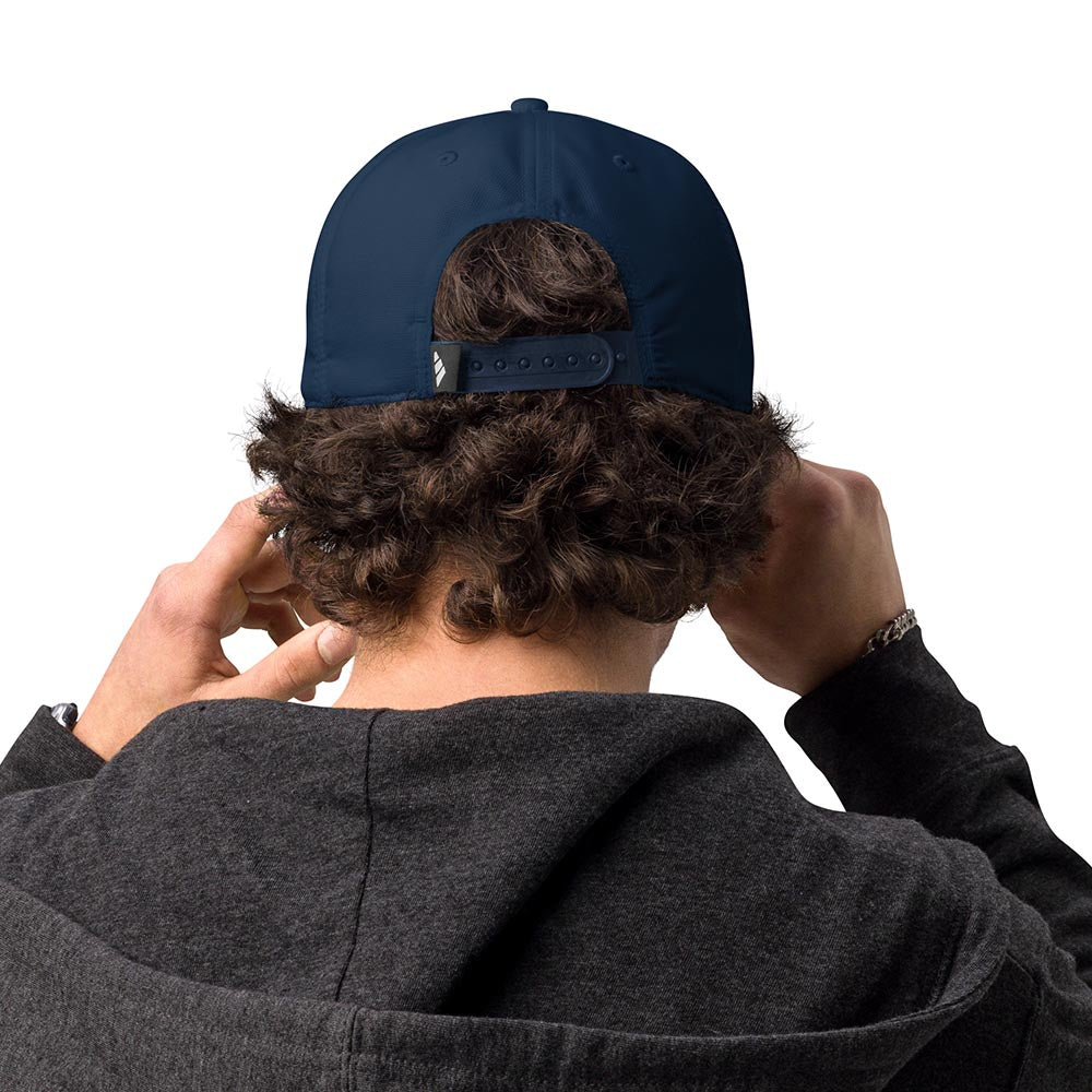 Man wearing a navy Adidas performance cap, rear view showing adjustable snap closure