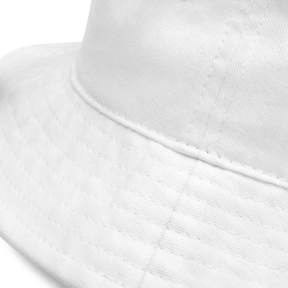Close-up of white bucket hat fabric and stitching detail from 'Tight Lines' collection