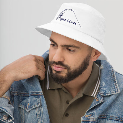 White fishing hat with "Tight Lines" text and fishing hook graphic, worn with denim jacket. - Tight Lines Bucket Hat - Light