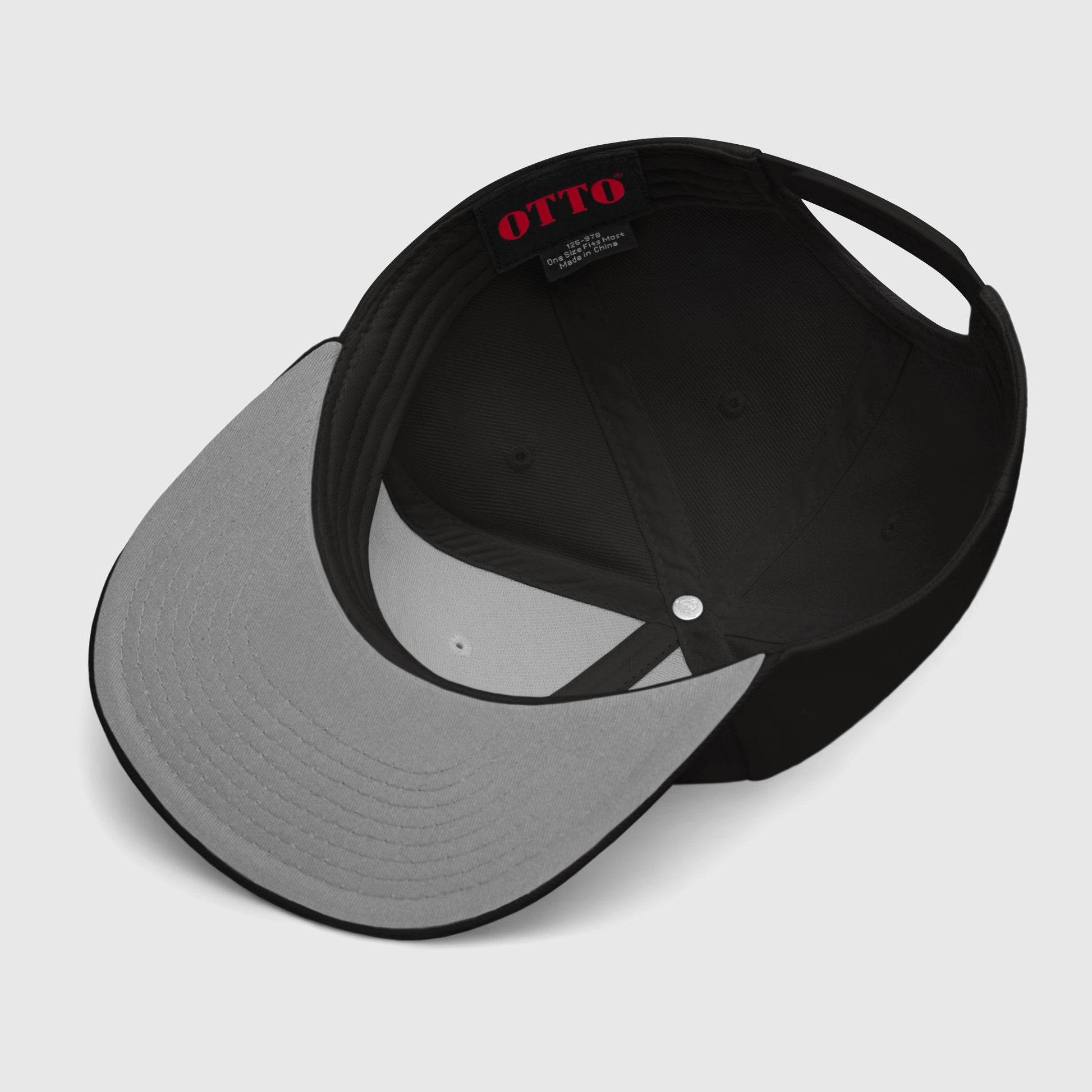 Underside view of snapback with grey visor interior