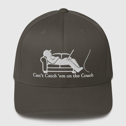 Dark grey structured ball cap with embroidered reclining fisherman graphic and "Can't Catch 'Em on the Couch" text, funny. - Can't Catch 'Em Structured Ball Cap - Dark