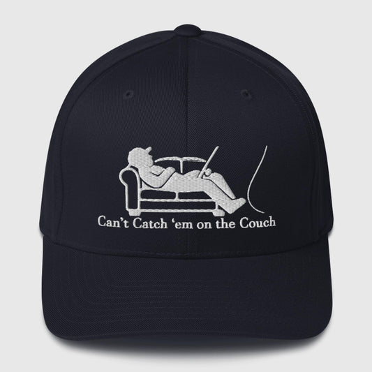 Navy dad hat with white couch and fisherman graphic, slogan underneath