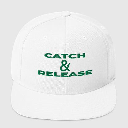 White snapback fishing hat with green "Catch & Release" text embroidered on front, funny fishing hat design. - Catch & Release Snapback
