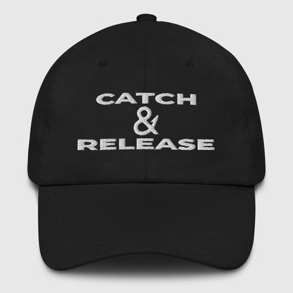 Black dad hat with white "Catch & Release" text, funny fishing hat design. - Catch & Release Dad Hat
