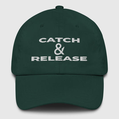 Dark green fishing hat with white embroidered "Catch & Release" text on front, dad hat style. - Catch & Release Dad Hat