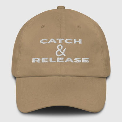 Khaki fishing hat with white embroidered "Catch & Release" text, classic dad hat style. - Catch & Release Dad Hat