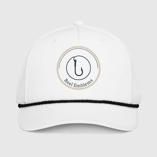 White cap with “Reel Emblems” logo on a light gray background
