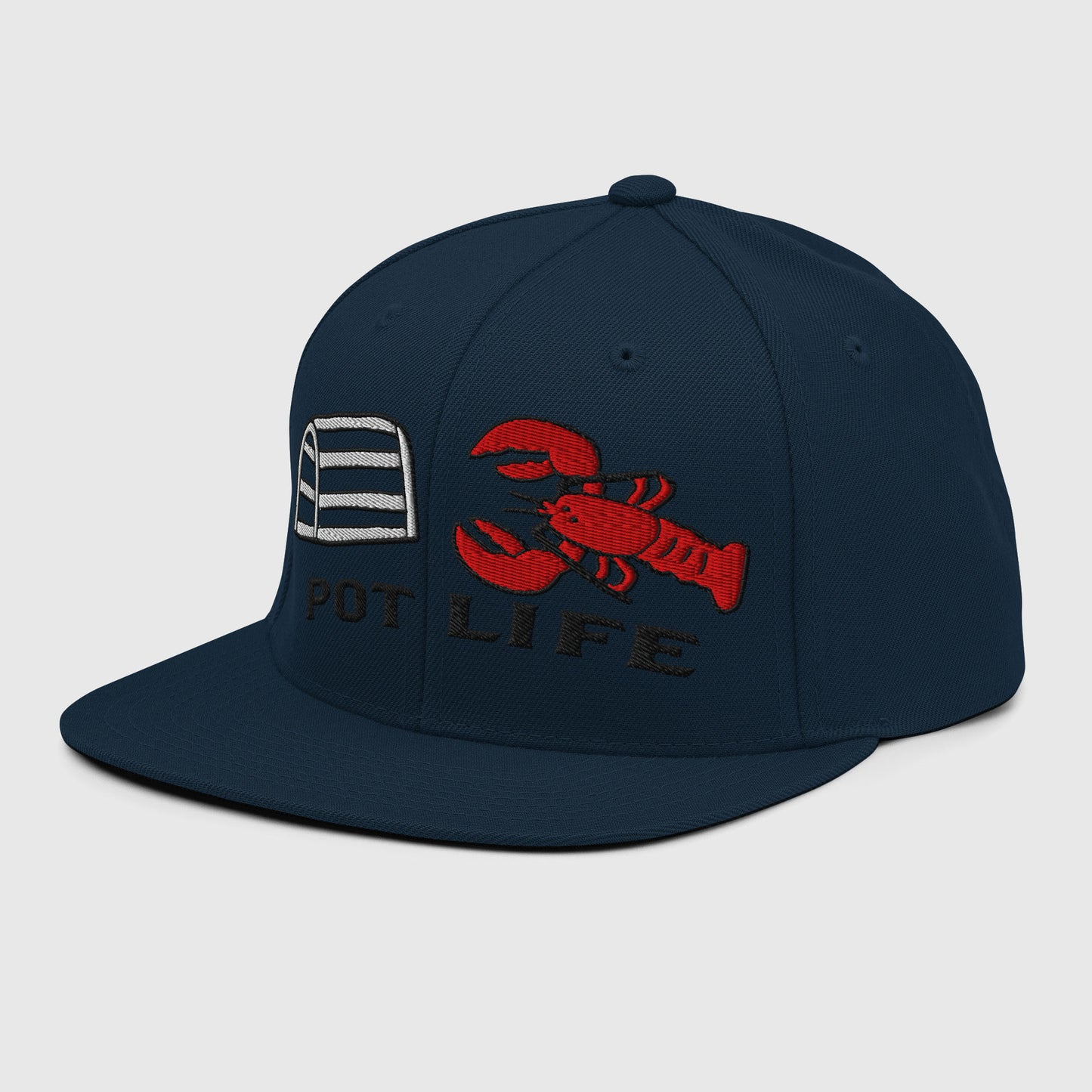 Angled view of dark navy snapback hat with embroidered lobster trap, red lobster, and “POT LIFE” text