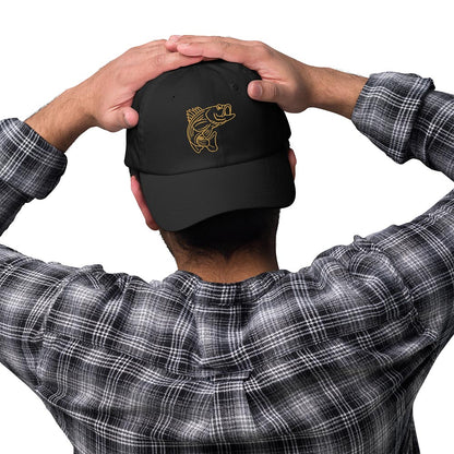Black dad hat with gold striped bass graphic, casual fishing hat with funny fishing design. - Striped Bass - Fish Series Dad Hat