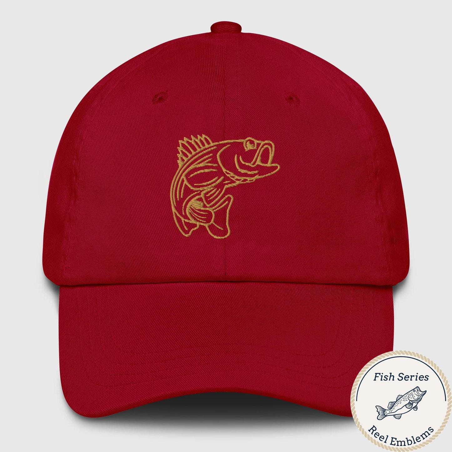 Cranberry red dad hat with gold embroidered bass emblem