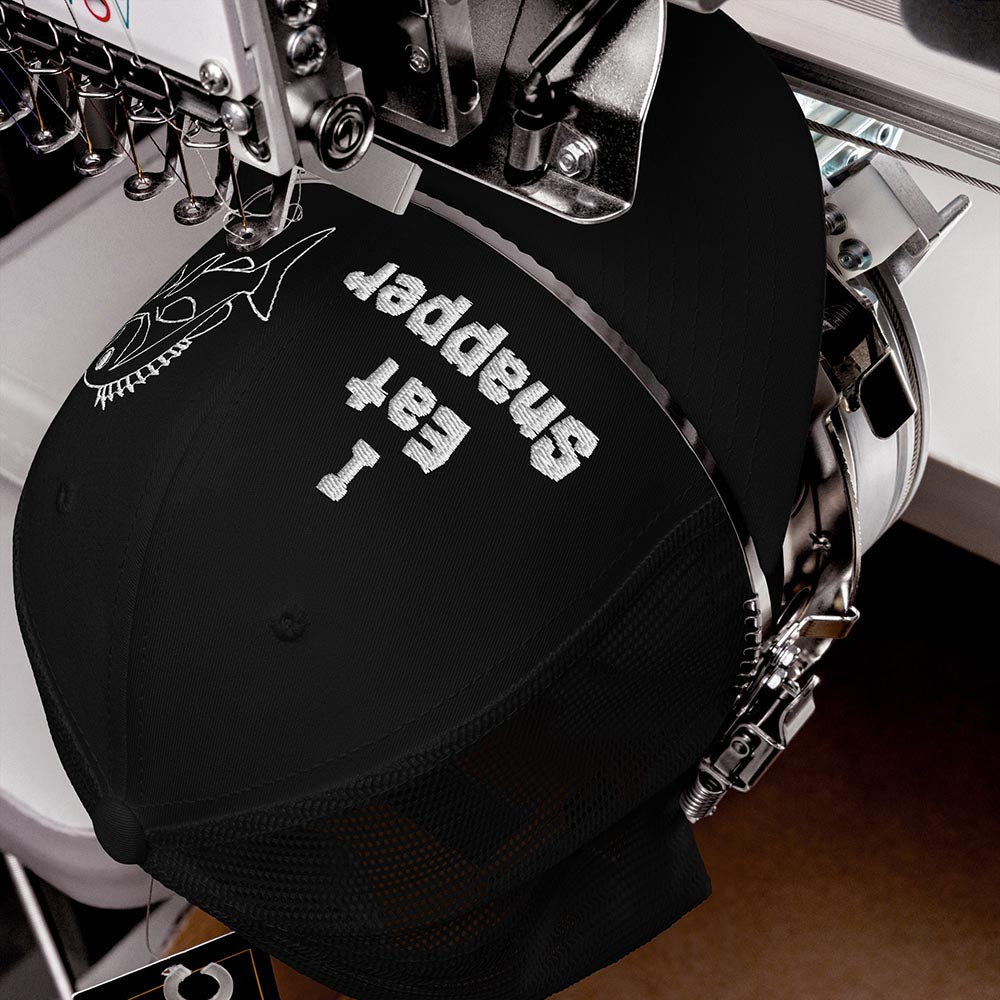 Front view of I Eat Snapper Mesh Hat on embroidery machine