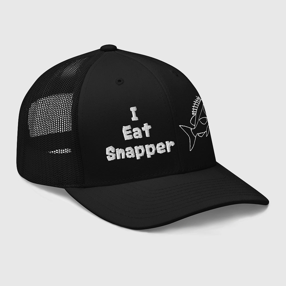 Side angle view of black mesh back trucker cap with white “I Eat Snapper” text and fish embroidery