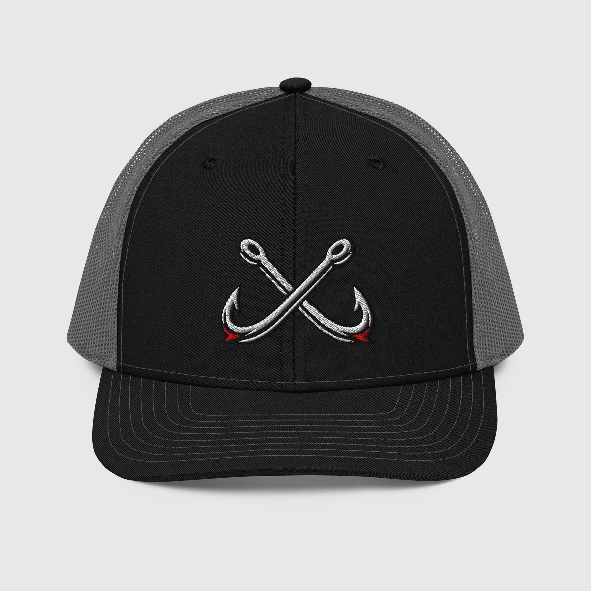 Black and charcoal trucker hat with crossed fishing hooks embroidery, funny fishing hat style. - Crossed Hooks Trucker Hat – Richardson 112 Fishing Hat
