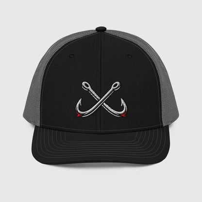 Black and charcoal trucker hat with crossed fishing hooks embroidery, funny fishing hat style. - Crossed Hooks Trucker Hat – Richardson 112 Fishing Hat