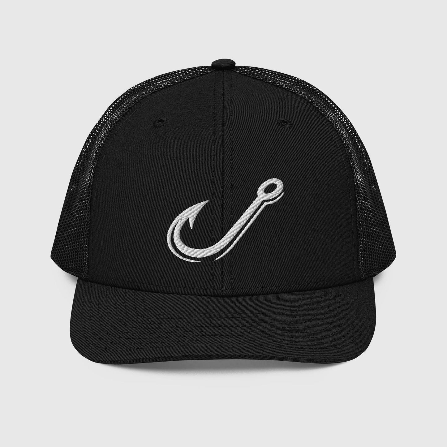 Black Richardson 112 trucker fishing hat with a white embroidered fishing hook graphic and mesh back. - Classic J Hook Trucker Hat – Richardson 112 Fishing Hat